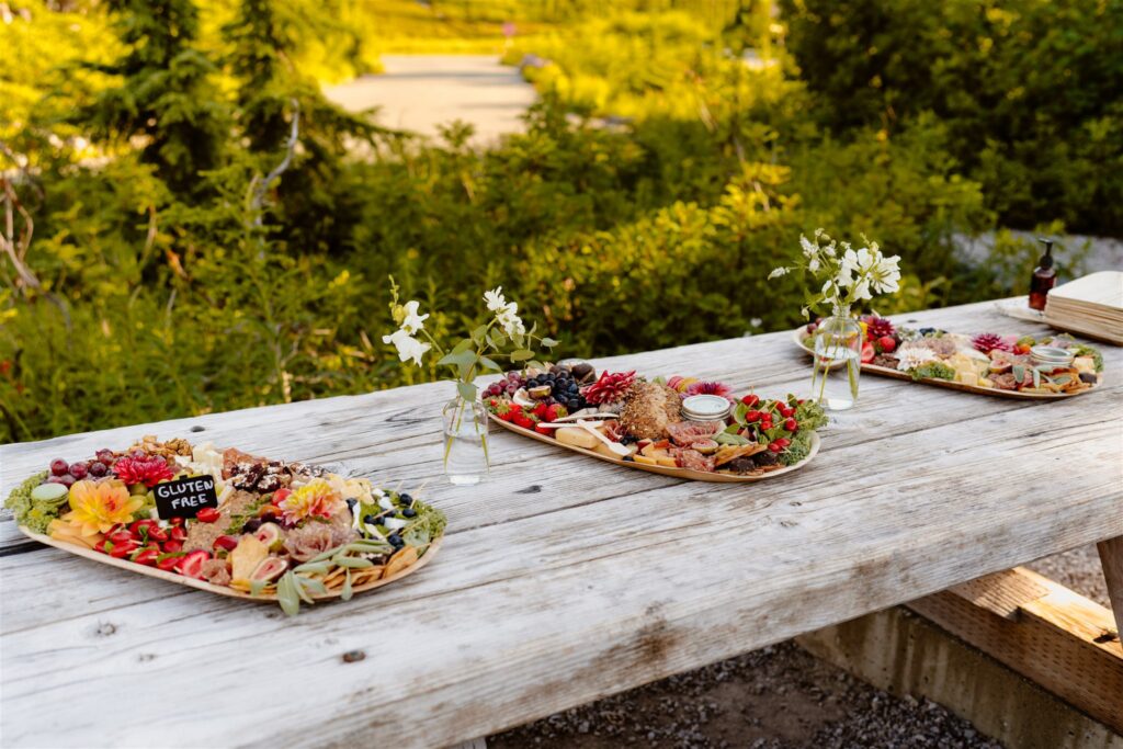 Charcuterie boards at wedding picnic table